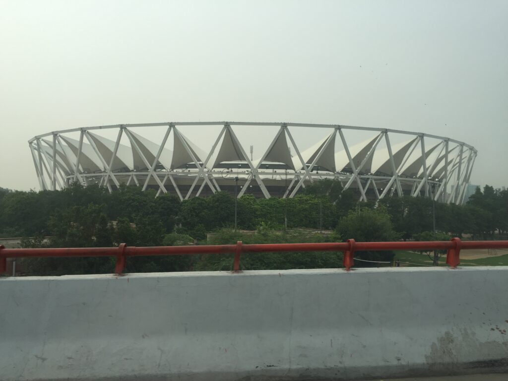 Barapullah Phase III Traffic Chaos: Sharp Merges and Lane Bottlenecks Under Scrutiny in Delhi View of Jawaharlal Nehru Stadium from the Barapullah flyover in Delhi