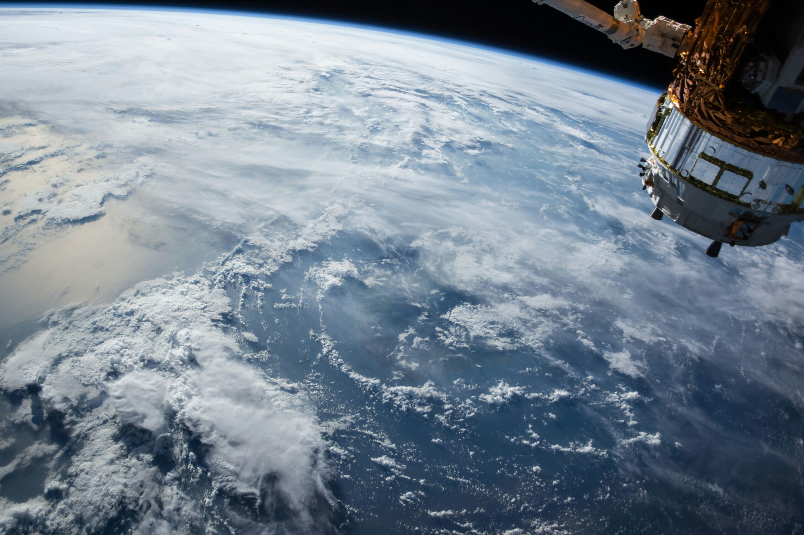 ShepHertz’s Tatva, Sanjaya and Drashta Bring Offline AI to Drones, Satellites and Other Constrained Devices Earth and clouds seen from orbit, illustrating satellite environments where on-device AI can operate without a network connection
