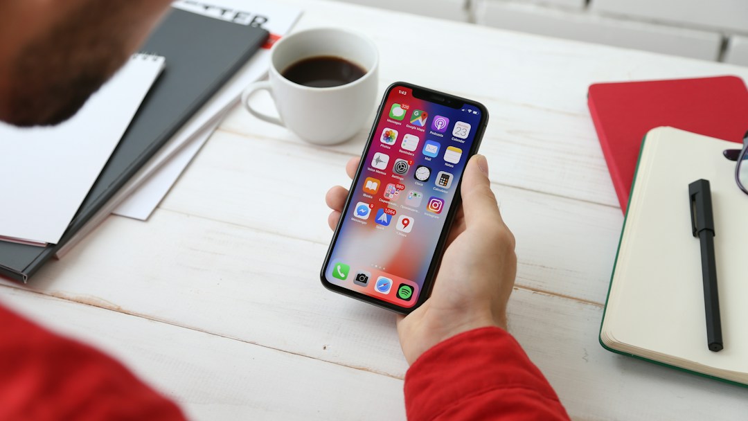 Smartphone on a desk, representative image for a discussion of on-device AI assistants