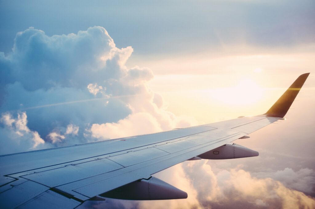 Singapore Airlines' 25.1% Air India Stake Faces a New Test as Funding Talks Intensify Commercial passenger aircraft flying above clouds, illustrating Singapore Airlines' investment in Air India's turnaround