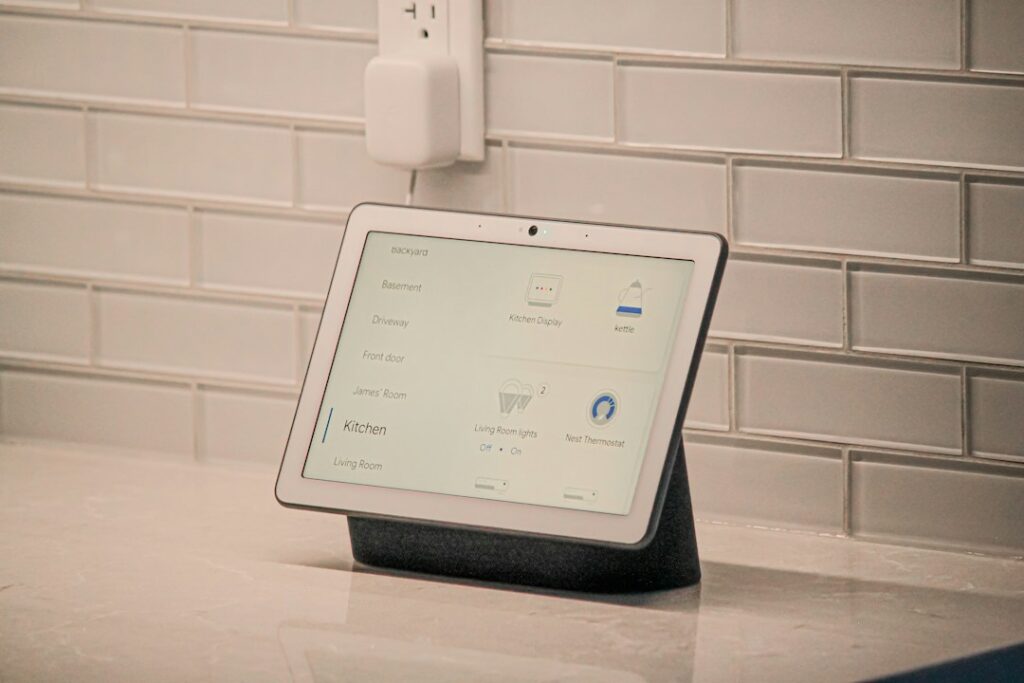 A smart home screen device shown as a representative image; not the unreleased OpenAI device mentioned in the lawsuit