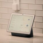 A smart home screen device shown as a representative image; not the unreleased OpenAI device mentioned in the lawsuit