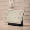 A smart home screen device shown as a representative image; not the unreleased OpenAI device mentioned in the lawsuit
