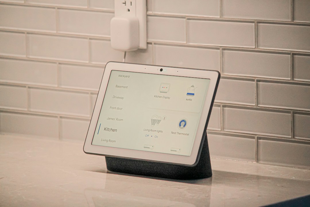 A smart home screen device shown as a representative image; not the unreleased OpenAI device mentioned in the lawsuit